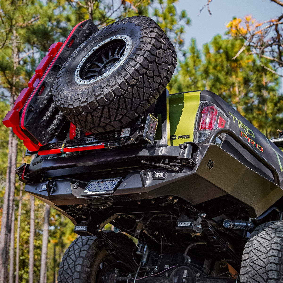 Tacoma Overland Series High Clearance  Rear Bumper / 3rd Gen / 2016-2023 | Single Full Length Swing Arm With Tire Carrier - Passenger Side Pivot / Driver Side Latch | No Side Tubes | Raw - Unfinished