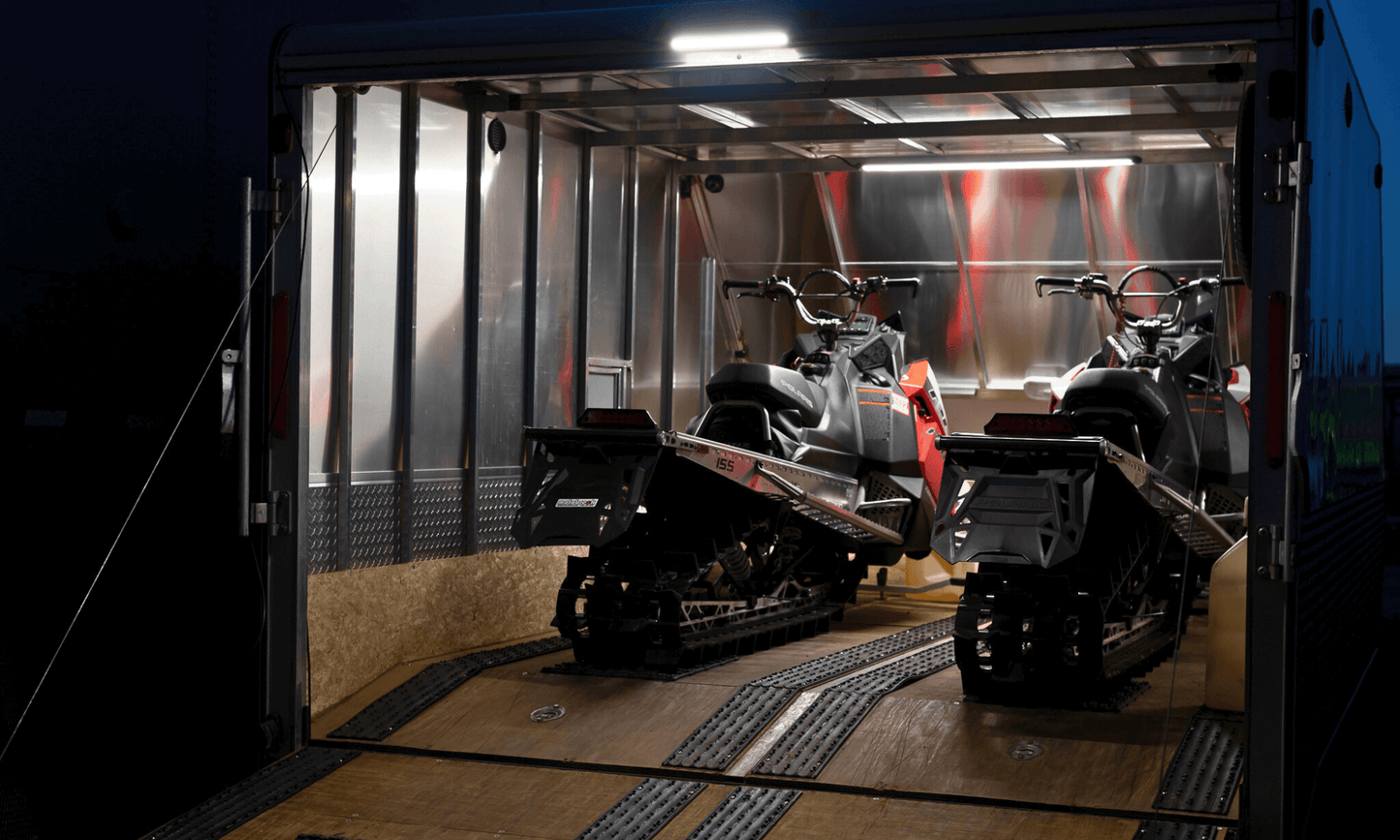 Kingpin LED lights on interior and exterior of enclosed snowmobile trailer. The v-Series 12" light bar illuminating trailer ramp door nicely. 